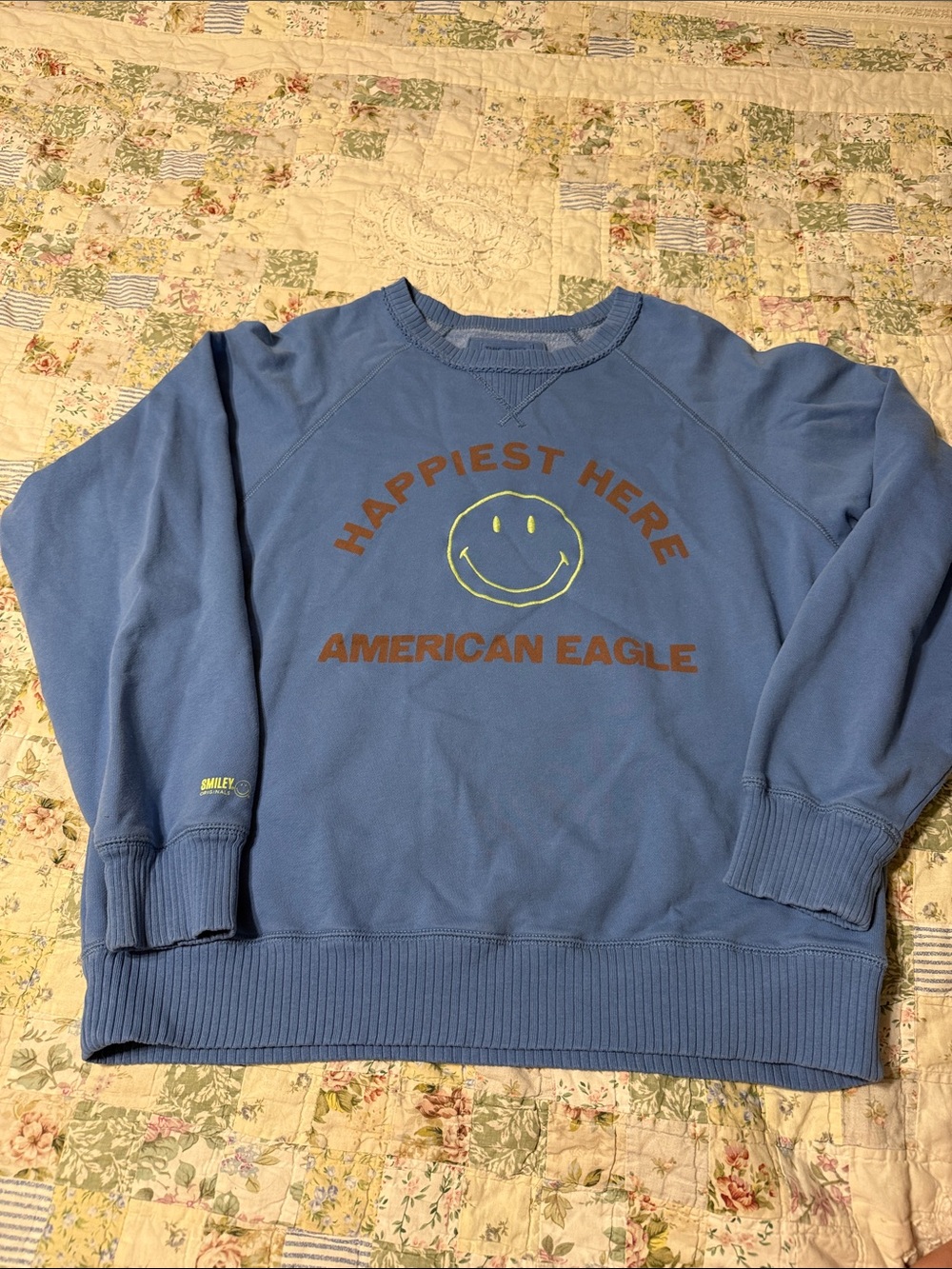 American Eagle Outfitters Light Blue 'Happiest Here' Smiley Crewneck